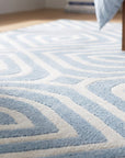 Rhea Stylish Blue Hand Tufted Wool Rug in a bedroom
