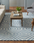 Rhea Stylish Blue Hand Tufted Wool Rug in a living room