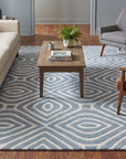 Rhea Stylish Blue Hand Tufted Wool Rug in a living room