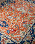 Rust Oushak floral wool rug, angled full view