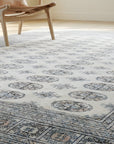Rustic Nina Beige Hand Knotted Wool Rug in a sunroom