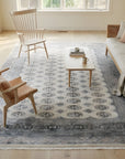 Rustic Nina Beige Hand Knotted Wool Rug in a sunroom