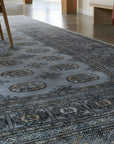 Rustic Nina Gray Hand Knotted Wool Rug in a dining room