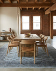 Rustic Nina Gray Hand Knotted Wool Rug in a dining room