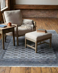 Rustic Nina Gray Hand Knotted Wool Rug in a reading nook