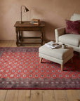 Rustic Nina Red Hand Knotted Wool Rug in a reading nook
