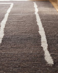 Talia Delicate Brown Flatweave Wool Rug in a hallway
