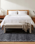 Talia Moroccan Charcoal Hand Knotted Wool Rug in a bedroom