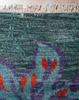 Teal contemporary floral rug corner detail