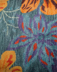 Teal contemporary floral rug blossom motif close-up