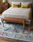 Tessa Laine Blue Hand Knotted Wool Rug in a bedroom