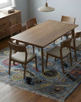 Tessa Laine Blue Hand Knotted Wool Rug in a dining room