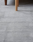 Tessa Maya Gray Hand Knotted Wool Rug in a bedroom