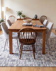 Tessa Sophisticated Gray Hand Knotted Wool Rug in a dining room