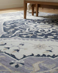 Timeless Oriental Ivory and Gray Hand Knotted Wool Rug in a bedroom