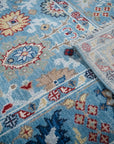 Turquoise Oushak rug field and hand-knotted back detail