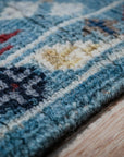 Turquoise Oushak rug border close-up