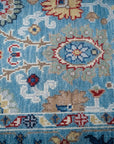 Turquoise Oushak rug corner and floral border detail