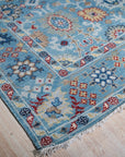 Turquoise Oushak rug corner and fringe detail