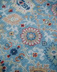 Turquoise Oushak rug floral field close-up