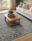 Turquoise Oushak floral rug styled in a bright living room