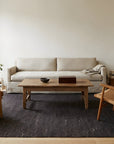 Charcoal Brown Artistic Flatweave Wool Rug in a living room