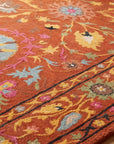 Willow Rust Hand Tufted Wool Rug in a dining room