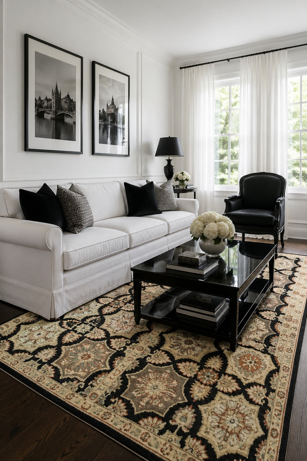 Timeless Agra Black and Ivory Hand Knotted Wool area rug styled in a refined classic living room with white sofa and natural light - lifestyle photo