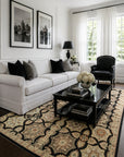 Timeless Agra Black and Ivory Hand Knotted Wool area rug styled in a refined classic living room with white sofa and natural light - lifestyle photo