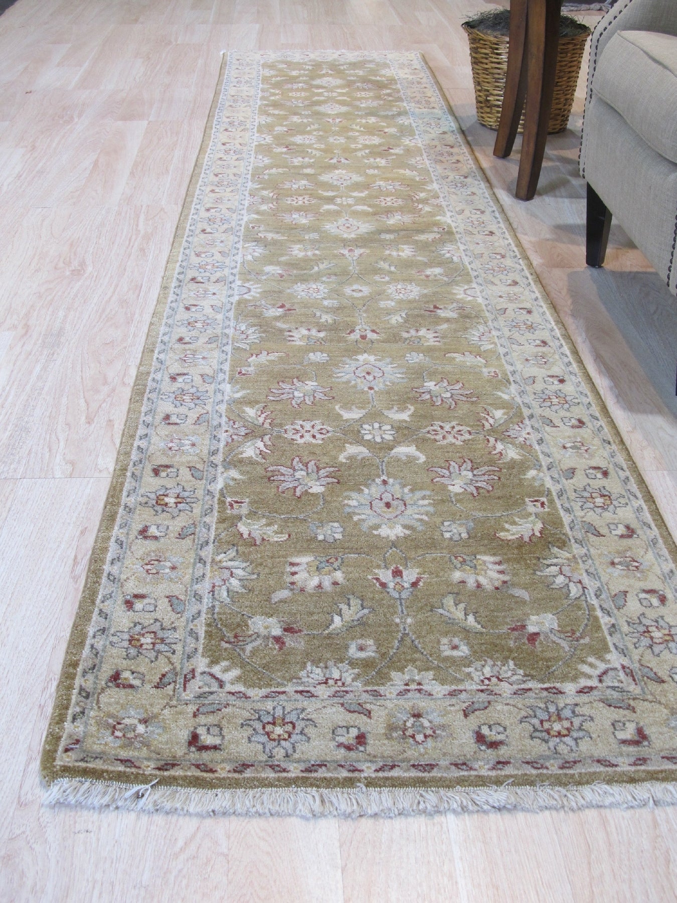 Violet Oriental Beige Hand Knotted Wool Rug, warm beige and violet tones intertwine in this hand-knotted wool rug, showcasing its intricate Oriental design and texture in a well-lit room setting.