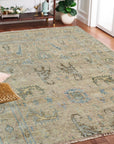 Captivating Traditional Beige Hand Knotted Wool Rug, a beige wool rug with an intricate traditional design, seen in a bright living room setting with natural light highlighting its texture.