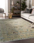 Captivating Traditional Beige Hand Knotted Wool Rug, its intricate floral and geometric patterns displayed in a well-lit interior setting, revealing the plush texture of its beige wool construction.