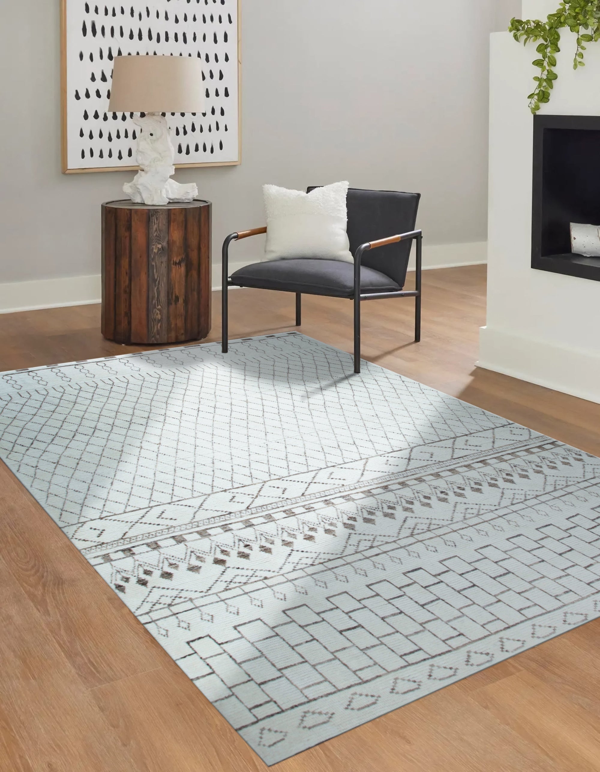 Jasmine Moroccan Ivory Hand Knotted Wool Rug laid on a light wood floor, its textured ivory wool pile and subtle Moroccan-inspired geometric patterns creating a warm and inviting atmosphere.