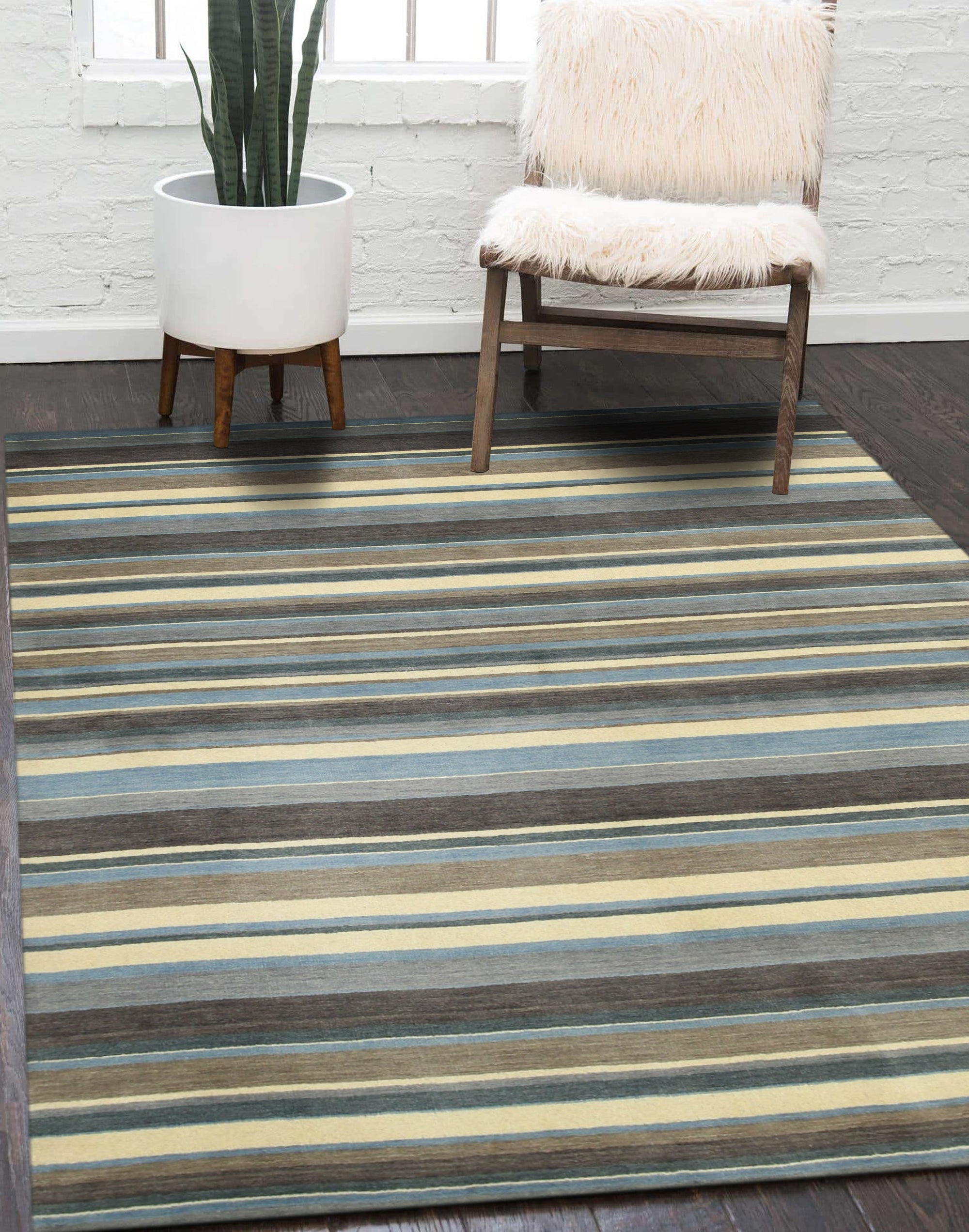 Lila Fiona Multicolor Handmade Wool Rug displayed in a well-lit living room setting, showcasing its vibrant color palette and textured wool construction amidst neutral furniture and warm lighting.