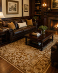 Tessa Ella Brown Hand Knotted Afghan Wool area rug styled in an elegant traditional living room with dark leather sofa and fireplace - lifestyle photo