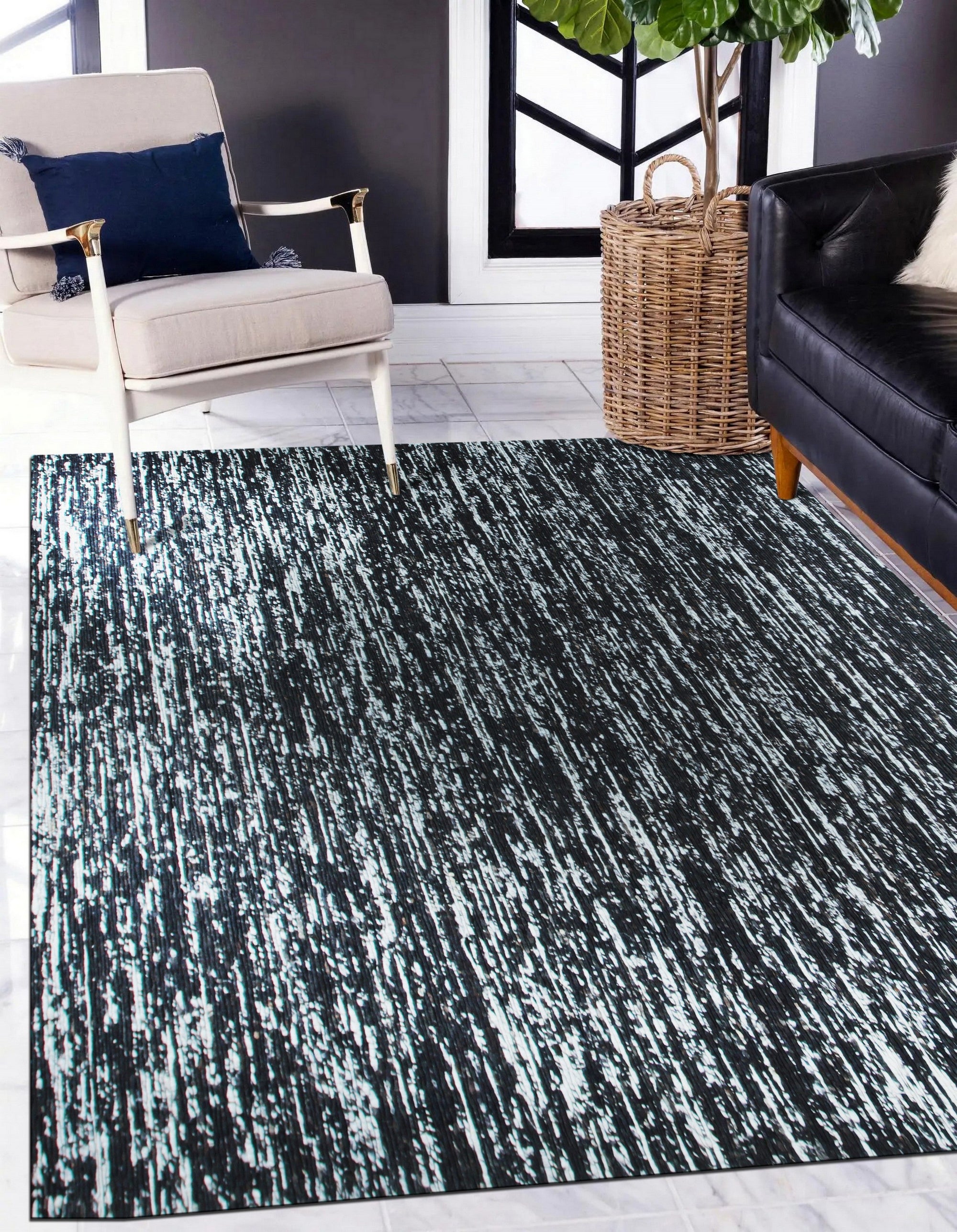 Fiona Rustic Black Flatweave Wool Rug, a textural expanse of woven wool, lies flat, its black hue grounding a space. Subtle variations in the weave create depth and rustic charm.