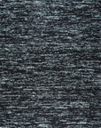 Fiona Rustic Black Flatweave Wool Rug styled in a modern living room - area rug lifestyle photo