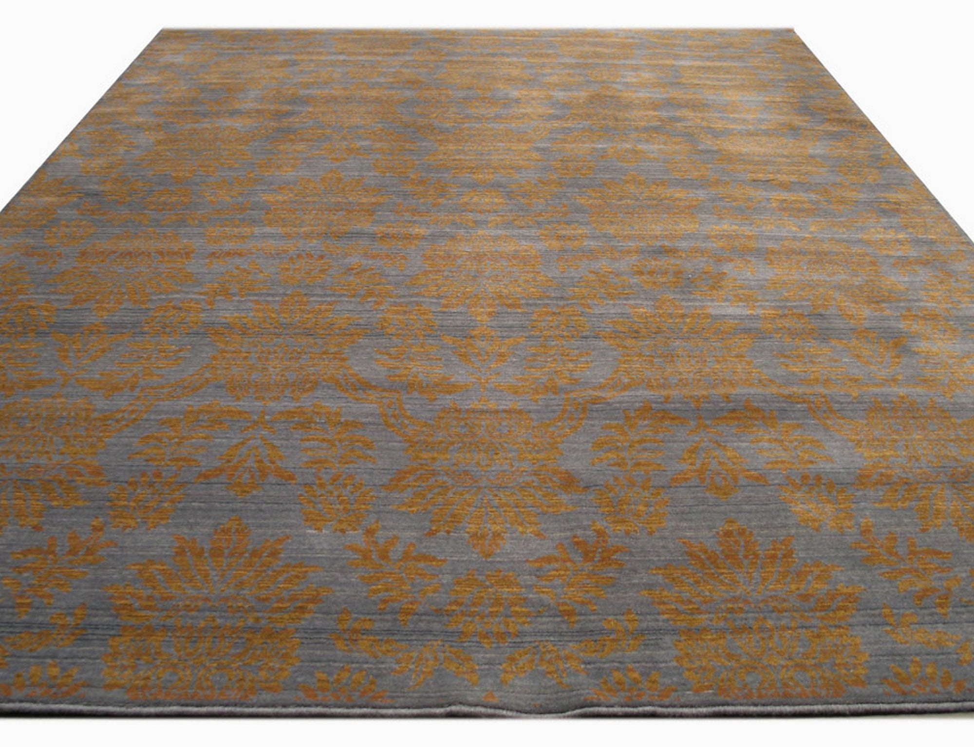 Stylish Vibrant Blue Machine Made Wool Rug, its intricate geometric pattern unfolding in shades of deep blue and lighter azure, creating a vibrant focal point against a light-colored floor.