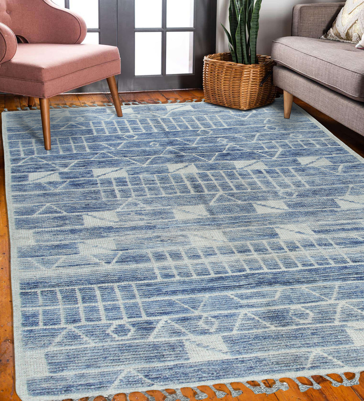 Elegant Marrakech Blue Hand-Knotted Wool Rug, vibrant blues and creams dance across a hand-knotted wool rug, illuminating a sunlit living room with intricate Moroccan-inspired motifs.