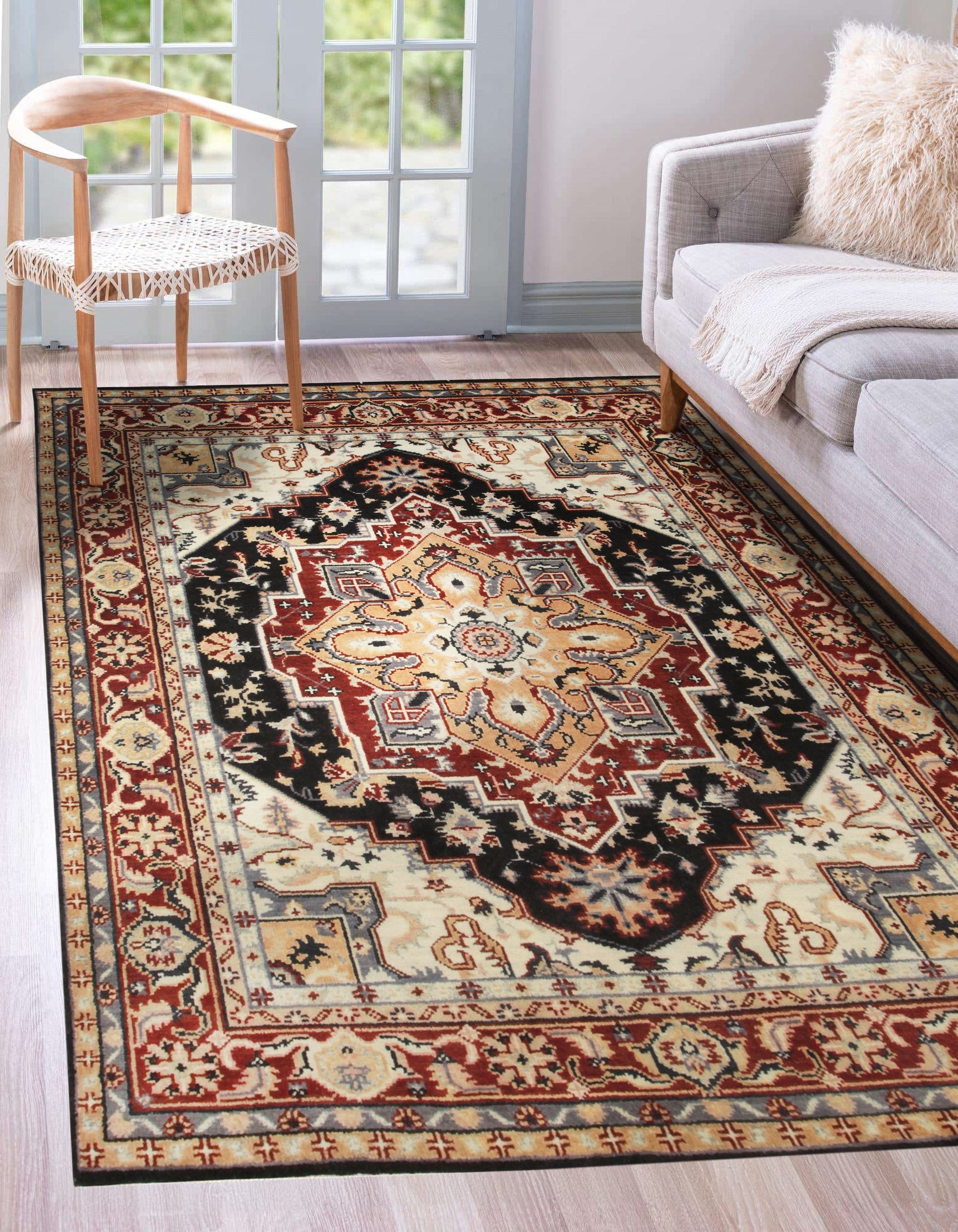 Ella Oriental Navy Hand Knotted Wool Rug, displays intricate navy and beige patterns. Hand-knotted construction offers depth and texture, visible against a light surface.