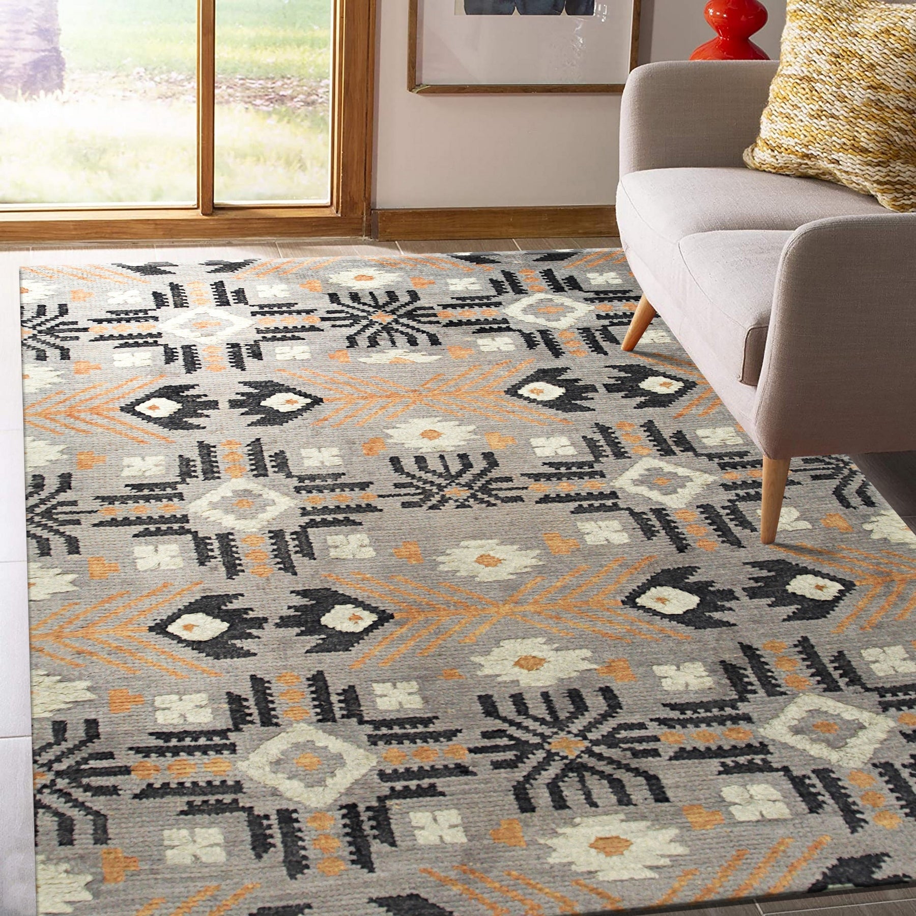 Laine Enchanting Gray Hand Knotted Wool Rug, showcasing its intricate hand-knotted construction and subtle gray tones, graces a modern living space.