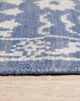 Ava Agra Blue Hand Knotted Wool & Bamboo Silk Rug, its intricate pattern unfolding in serene blues, woven from wool and shimmering bamboo silk, grounding a contemporary living space.