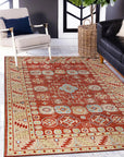 Kira Zinnia Rust Hand Knotted Wool Rug, its rich crimson tones and intricate hand-knotted wool construction bring warmth and texture to a stylish living room setting.