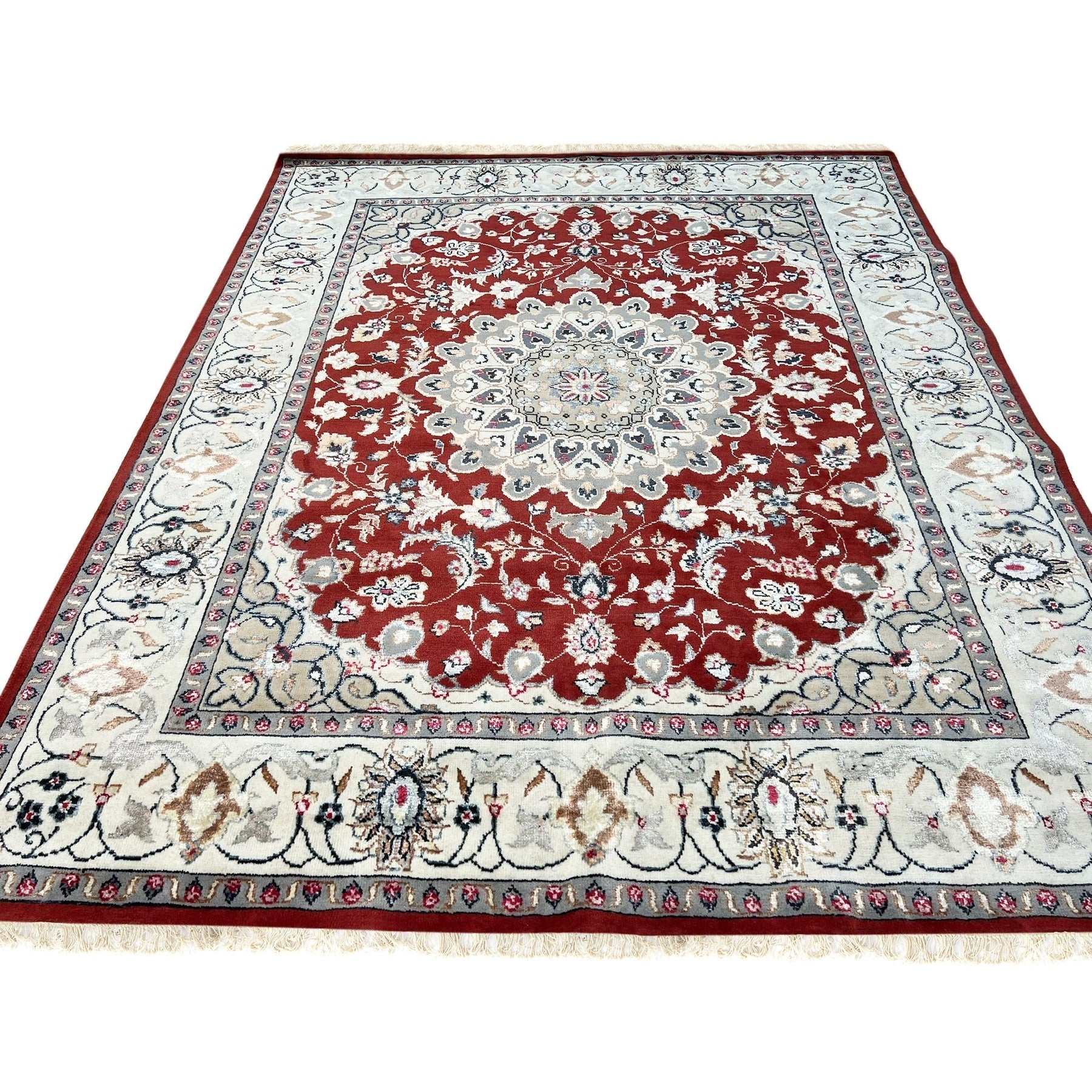 Selene Trara Red Hand Knotted Wool &amp; Silk Rug, showcasing intricate patterns in rich reds, creams, and subtle blues, its luxurious texture evident in a living room setting with mid-century modern furniture.