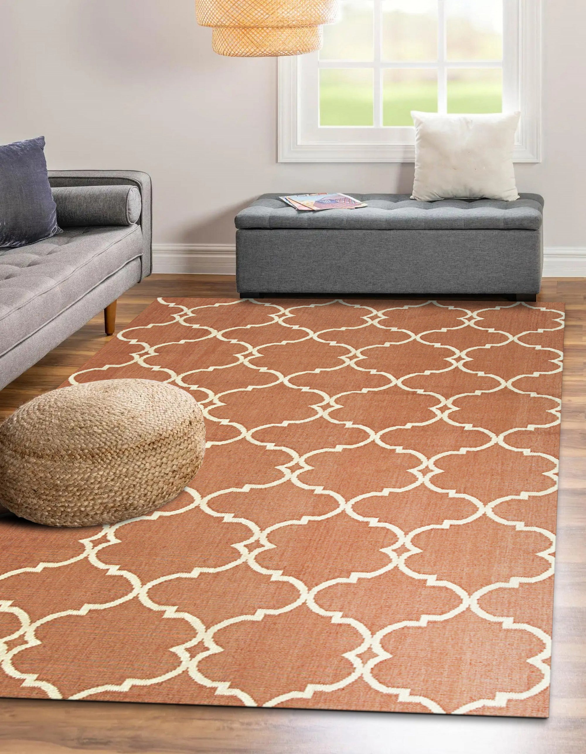 Opulent Delicate Orange Hand Knotted Rug, viewed in a living room setting, showcasing its intricate hand-knotted construction and warm orange tones against a light-colored floor.