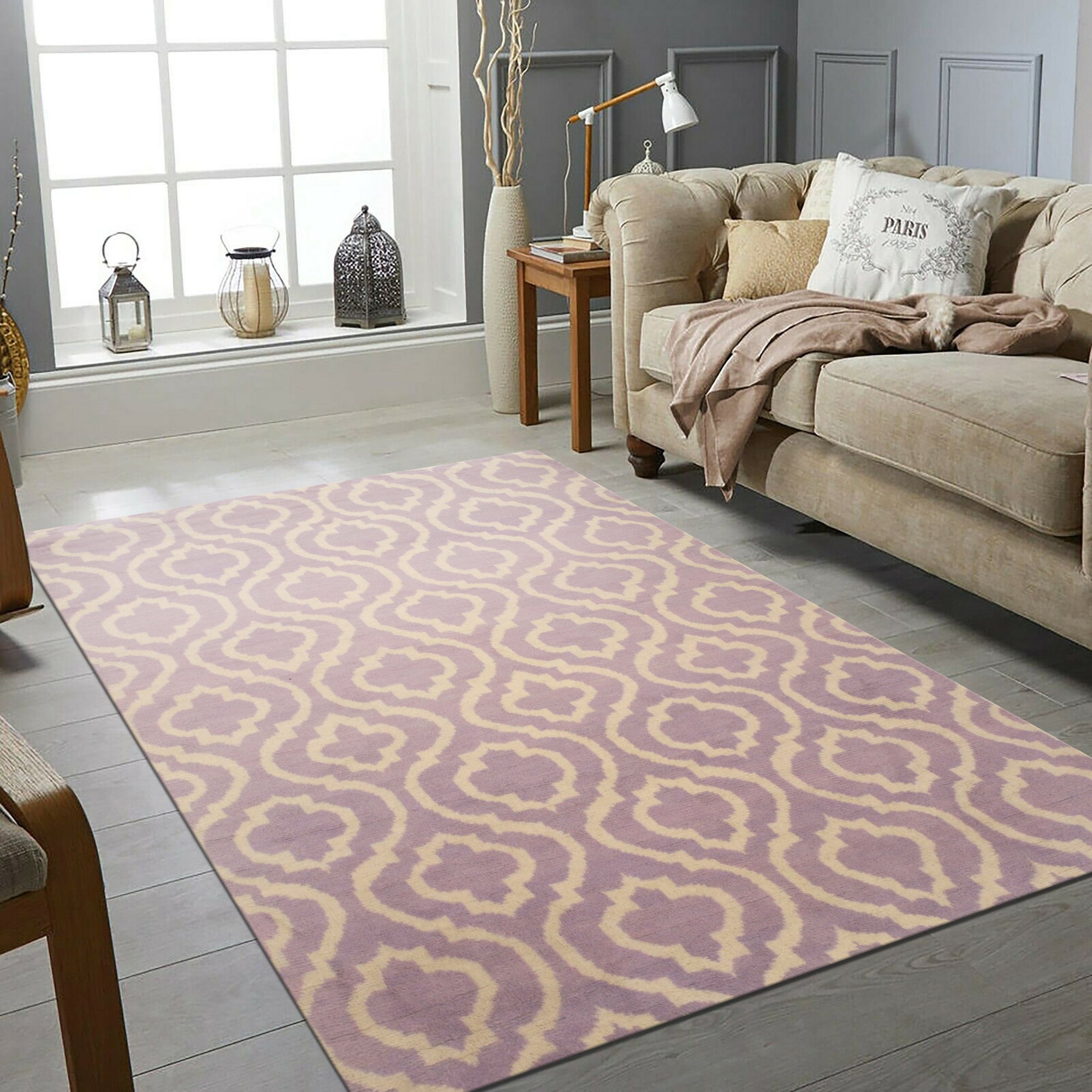 Elegant Moroccan Purple Hand Knotted Wool Rug, its intricate knotwork and vibrant purple hues radiating warmth in a brightly lit, modern living room.