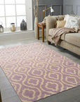 Elegant Moroccan Purple Hand Knotted Wool Rug, its intricate knotwork and vibrant purple hues radiating warmth in a brightly lit, modern living room.