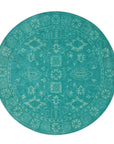 Louie Oriental Turquoise Hand Tufted Wool Rug, vibrant turquoise and cream hues swirling in a traditional Oriental pattern, hand-tufted wool construction adding plush texture to a modern living space.