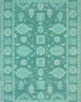 Isolated view of Louie Oriental Turquoise Hand Tufted Wool Rug, showcasing its design.