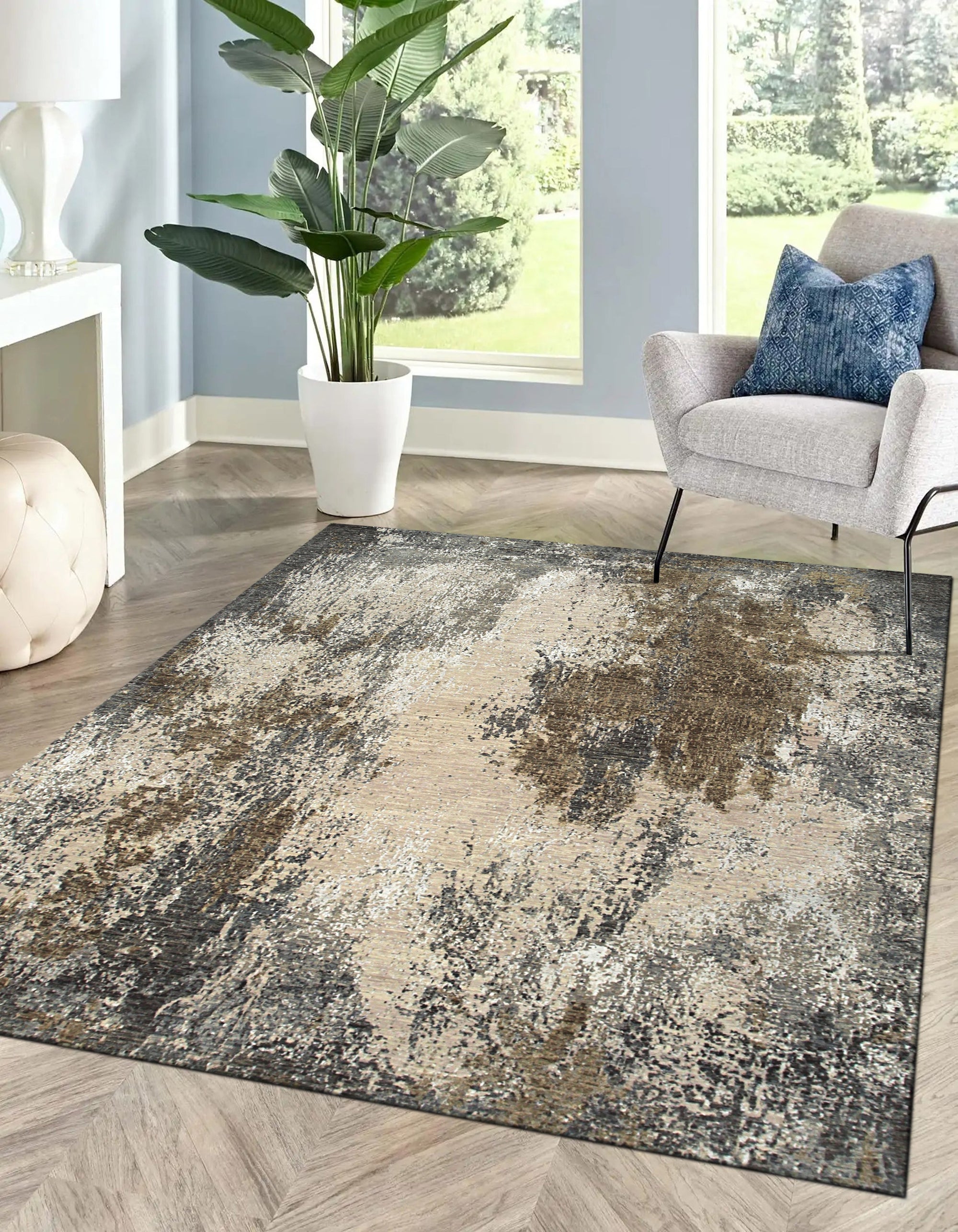 Xena Chloe Gray Hand Knotted Wool Rug, a soft gray wool rug with a subtle, geometric pattern, resting on a light hardwood floor.